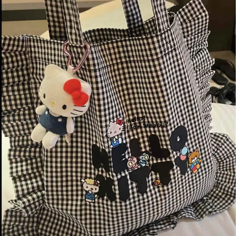 Sanrio Hello Kitty, милая студенческая сумка для поездок на работу в черно-белую клетку, портативная холщовая сумка на одно плечо с рюшами