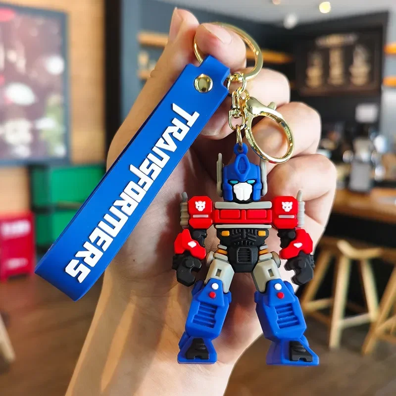 Фото Брелок-трансформеры, фигурки героев, Optimus Prime, подвески Шмель, аниме, автомобильный брелок для ключей, мультяшная кукла, рюкзак, подвеска, игрушки, подарок №3